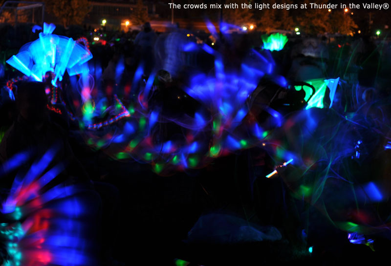 The crowds mix with the light designs at Thunder in the Valley