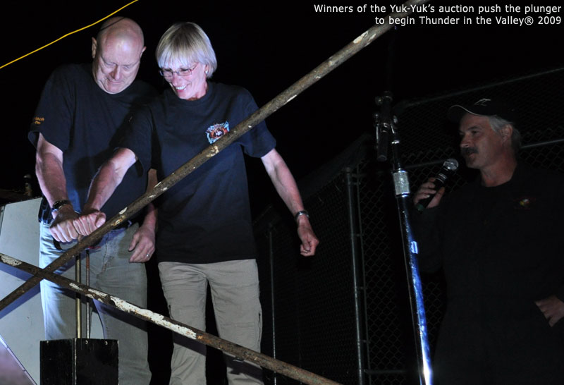 Winners of the Yuk-Yuk's auction push the plunger to begin Thunder in the Valley 2009