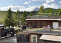 The old school yard is filled with large and small equipment and tools of the era