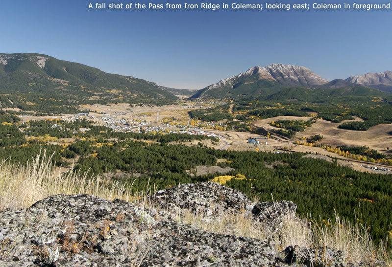 A fall shot of the Pass from Iron Ridge in Coleman; looking east; Coleman in foreground