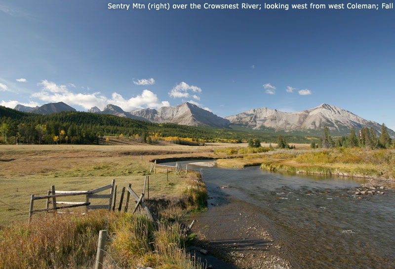 Sentry Mtn (right) over the Crowsnest River; looking west from west Coleman; Fall