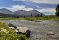 Sentry Mtn (centre) over the Crowsnest River; looking west from west Coleman; Summer