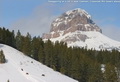 Tobogganing on a hill in west Coleman; Crowsnest Mtn towers above