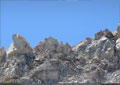 Small rock slides happen frequently as loose rock on the peak of Turtle Mountain give way