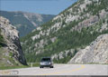 Crowsnest Hwy 3 winds through rocky terrain near the lakes