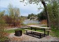 A camping spot by the river at Lundbreck Falls Campground
